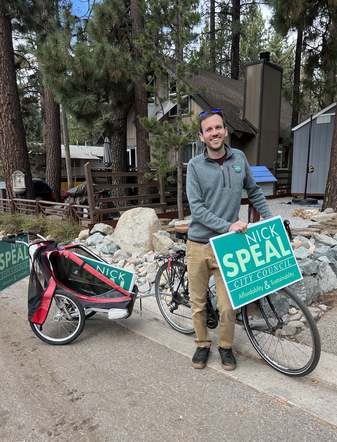 Nick with his bike and some yard signs